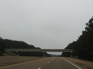 U.S. 84 bypasses Meadville to the south along a limited access highway with grade separations at Gloster Road and MS 556.