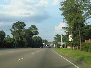 U.S. 84 proceeds east into the city of Laurel beyond Tallahoma Creek. Running along the south side of Laurel Country Club, U.S. 84 meets MS 15 (N 16th Avenue) at W 5th Street and the city street grid.