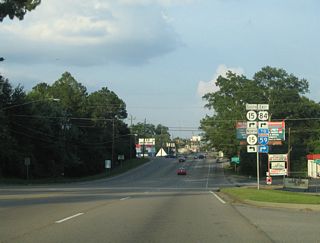 Circumventing Downtown Laurel, U.S. 84 turns south alongside MS 15 (N 16th Avenue) for 0.78 miles to Interstate 59. The historic alignment for U.S. 84 across the city followed W 5th Street, N 13th Avenue, W 6th Street, N 8th Avenue, W 7th Street, N 2nd Avenue, an overlap with U.S. 11, and Chantilly Street.