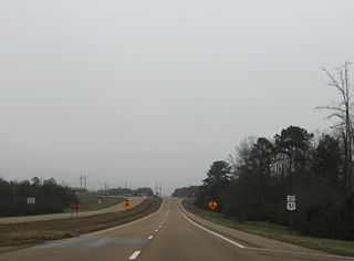 U.S. 84 converges with U.S. 51 at an four-way stop sign intersection. 2002 traffic counts here were just 9,100 vehicles per day (vpd) for U.S. 84 in 2002 and 7,800 vpd for U.S. 51.