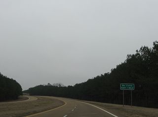 U.S. 98 commences south in one mile from a diamond interchange with U.S. 84 on the west side of Bude.