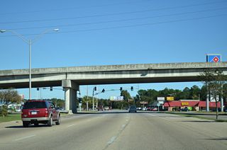 The overpass taking 14th Street across the nearby CSX Railroad also spans U.S. 90 (Denny Avenue).