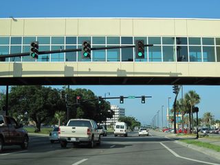 The Island View Casino pedestrian bridge spans U.S. 90 adjacent to the signalized intersection with 33rd Avenue.
