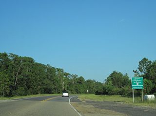 U.S. 90 enters Mobile County, Alabama east ahead of Grand Bay.