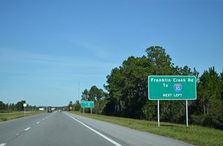 Franklin Creek Road meets Interstate 10 at Exit 75, 0.49 miles north of U.S. 90.