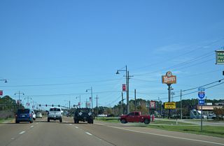Gautier-Vancleave Road comprises a four lane boulevard leading 3.12 miles north from U.S. 90 to Interstate 10 at Exit 61.