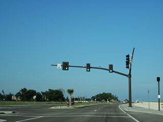 Traffic lights operate at the access road to Wal-Mart just east of Hayden Avenue.