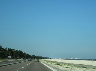 The roadways of U.S. 90 separate between a landscaped median twice along the coastal stretch through the city of Pass Christian.