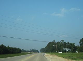 Lower Bay Road heads 2.72 miles south from U.S. 90 to Port Bienville Industrial Park as part of a 13.70 mile long loop course east to U.S. 90 along the Waveland city line.