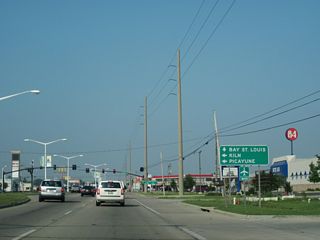 Nicholson Avenue extends 1.63 miles southeast from U.S. 90 at MS 43/603 to Beach Boulevard (MS 606) along Mississippi Sound.