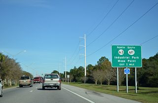 A folded diamond interchange joins U.S. 90 with MS 63 north and MS 611 south one mile northeast of Veterans Boulevard.