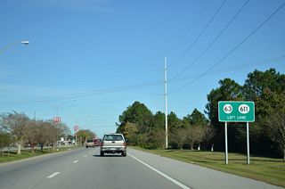 The signed leg of MS 611 spurs 4.17 miles south from the exchange at U.S. 90/MS 63 to the Pascagoula Refinery complex.