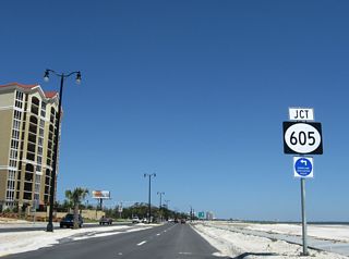 U.S. 90 meets MS 605 (Cowan Road) north past the Sienna condo tower.