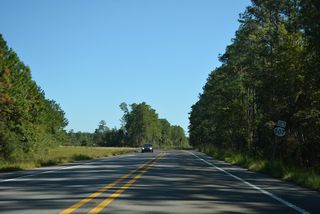 U.S. 90 overtakes the four lane highway extending east along MS 607 from Interstate 10 toward Waveland.