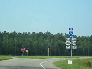 Prior to 2013, U.S. 90 overtook MS 607 east toward Waveland from a free flowing right turn.