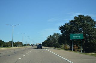 Unsigned MS 617 spurs 1.53 miles south from a trumpet interchange with U.S. 90 to the Ingalls Shipbuilding facility off Spanish Point along Mississippi Sound.