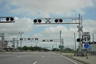 U.S. 90 crosses Kansas City Southern Railroad tracks leading into the Port of Gulfport ahead of the south end of U.S. 49.