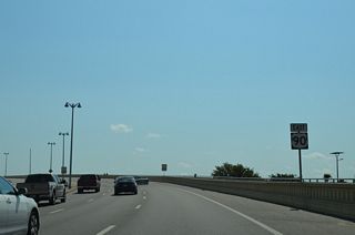 U.S. 90 curves northeast from Myrtle Street onto the Biloxi Bay Bridge.