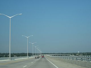 The St. Louis Bay Bridge curves south ahead of Henderson Point. The two mile long span includes a multi use trail along the south side.