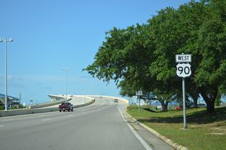 U.S. 90 continues southwest from Porter Avenue onto the Biloxi Bay Bridge.