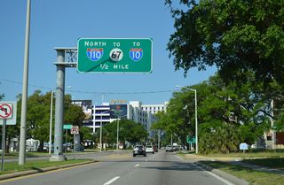 U.S. 90 (Beach Boulevard) advances a half mile west along a commercialized stretch from Dukate Street to Interstate 110 north.