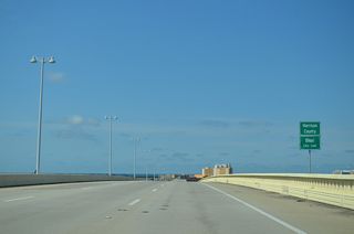 U.S. 90 enters Harrison County and the city of Biloxi west across the Biloxi Bay navigation channel.