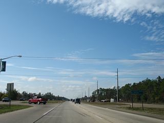 The guide sign referencing Clermont Harbor and Lakeshore for Lower Bay Road south from U.S. 90 was removed by 2016.