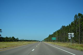 The four lane highway along U.S. 90 extends another 8.81 miles northwest to Interstate 10 as Mississippi Highway 607.