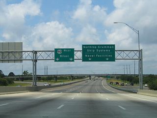 MS 617 leads 1.53 miles south to the Ingalls Shipbuilding complex. Unsigned MS 619 spurs 2.77 miles south from MS 617 along an elevated roadway to Naval Station Pascagoula.