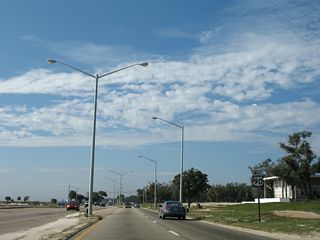 The U.S. 90 reassurance marker west of Ocean Club Boulevard was removed due to the construction of a sidewalk by 2009.