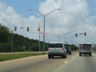Veterans Boulevard ties into U.S. 90 (Denny Avenue) south between big box retail centers.