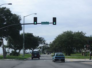 U.S. 90 (Beach Boulevard) west at White Avenue.