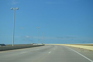 The $338.6 million design-built contract for the Biloxi Bay Bridge was awarded by MDOT in June 2006 (LaFontaine, Baker, Perez, Newsom, 2007). The span opened to traffic with two lanes on November 1, 2007 (Mississippi Press, 2007).