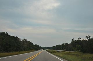 U.S. 98 continues with four lanes a half mile east from the state border to SR 158, which is the future alignment of U.S. 98 east to Interstate 65 at Saraland.