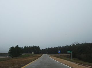 Elks Lake Road continues south from the freeway along U.S. 98 to the rural community of Dixie.