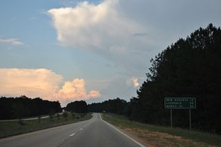 New Augusta is another 14 miles east along U.S. 98 while Lucedale is actually 49 miles away, despite this distance sign referencing the city at 52 miles. Mobile, Alabama is 87 miles to the southeast instead of 82.