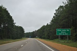 A diamond interchange follows along U.S. 98 west at Elks Lake Road.