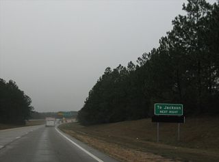U.S. 98 converges with I-59 at a trumpet interchange that includes grading for a loop ramp from I-59 north onto an unbuilt extension of the freeway west along U.S. 98.