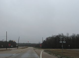 MS 13/184 and MS 43 converge at a four-way stop sign. MS 42 leads southeast to Sumrall and alongside U.S. 49 south to Hattiesburg.