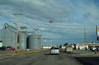 Railroad Street east at Central Avenue just outside the Cut Bank city center along U.S. 2. Central Avenue is the former alignment of S-213. The one-piece flasher here was removed after 2016.