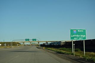 A folded diamond interchange joins U.S. 2 and the south end of Business Loop I-15 with Interstate 15 at Exit 363.