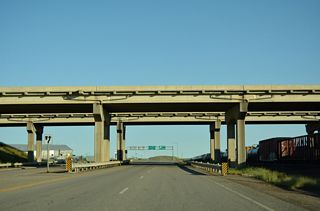Interstate 15 spans U.S. 2 (Roosevelt Highway) and the adjacent BNSF Railroad.