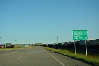 The Glacier County seat of Cut Bank lies 23 miles west of I-15 along U.S. 2. U.S. 2 meets U.S. 89 at Browning, with both routes leading toward Glacier National Park.