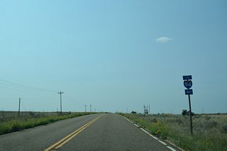 Powder River Road stems 0.54 miles east from Old Highway 10 to the modified diamond interchange with Interstate 94 at Exit 169.