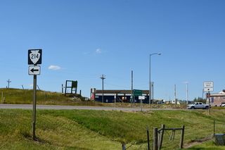 Unmarked on guide signs for Exit 397, S-214 ties into Interstate 15 along Loop Road east from Hillside Colony. The secondary highway runs 32.83 miles west from 3rd Avenue and I-15 to S-213 near Santa Rita.