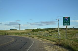 Interstate 15 is the Veteran's Memorial Highway in Montana. This sign stands along the southbound entrance ramp from S-214 at 2nd Street and Loop Road in Sweet Grass.