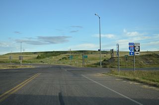 S-214 turns west onto Loop Road from 2nd Street at the entrance ramp for Interstate 15 south. S-214 continues 32.67 miles to S-213 near Santa Rita.