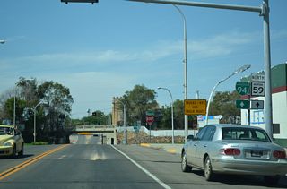Business Loop I-94 angles southwest along Valley Drive to combine with MT 59 (Main Street) northbound at Center Avenue.
