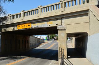 Business Loop I-94/MT 59 lower west below the BNSF Railway Main Street Overpass. The steel stringer bridge was built in 1932.