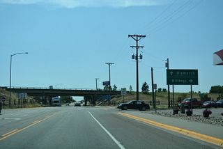 MT 59 south at the diamond interchange with Interstate 94 prior to the conversion into a dumbbell interchange.
